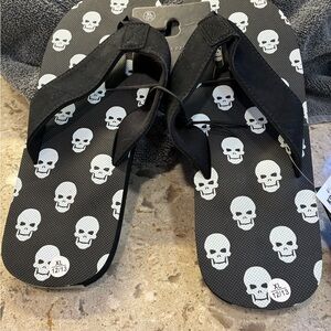 Bioworld Black Flip-Flops with White Skull Print